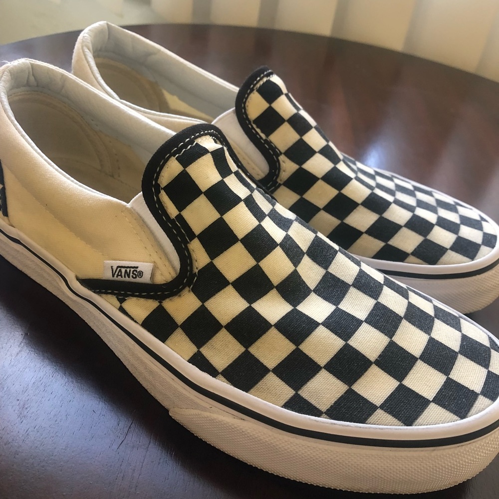 Vans checkered slip ons.